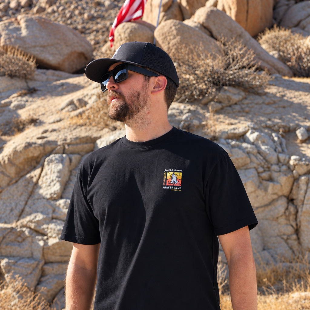 Man wearing the Saints & Sinners Prayer Club Catholic T-shirt – SIGNUMX lifestyle photo Front